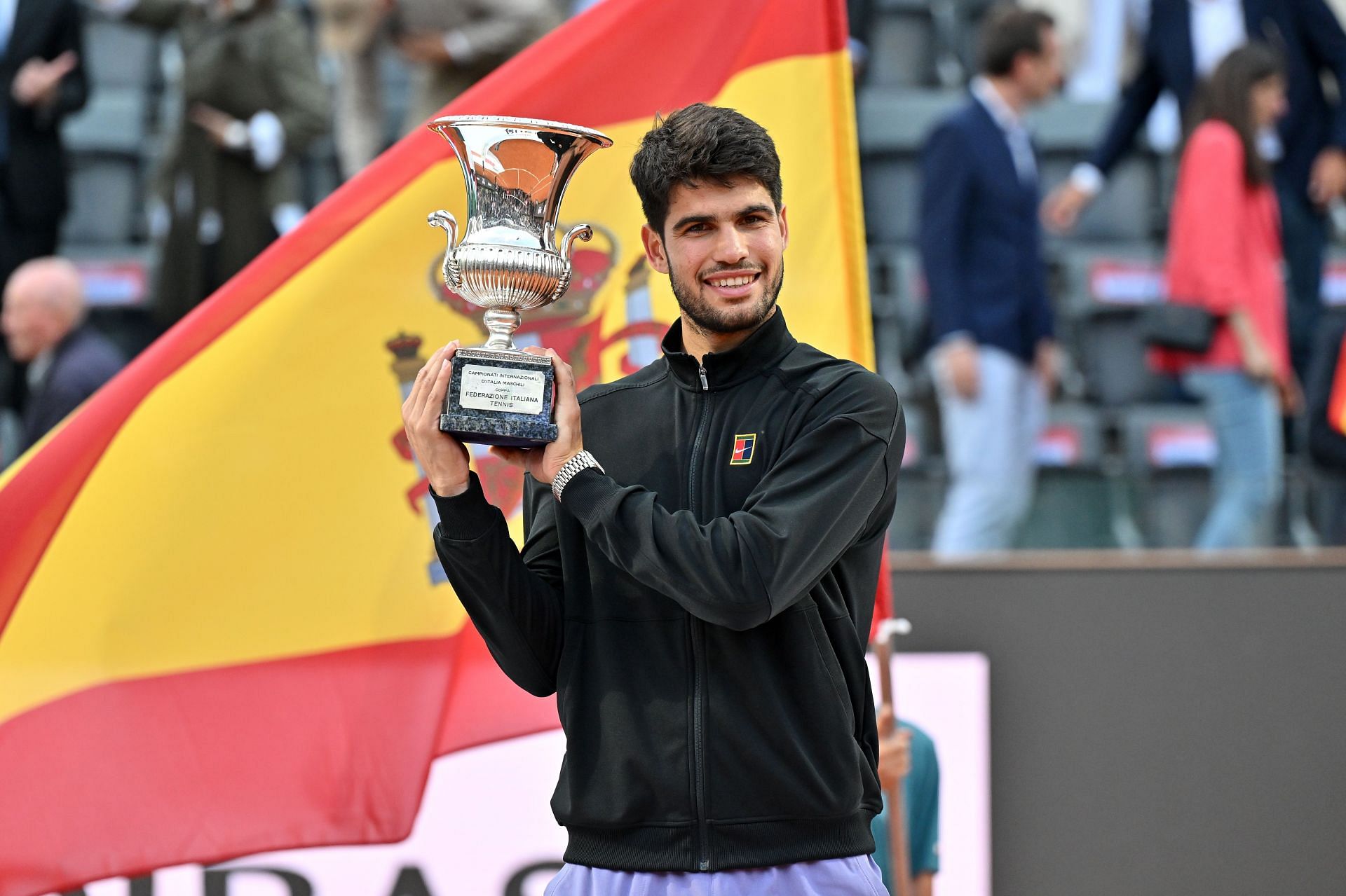 Carlos Alcaraz poses with the men's singles trophy at the 2025 Italian Open (Source: Getty)